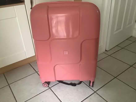 Photo of free Large pink roller suitcase (Wandsworth SW11) #1