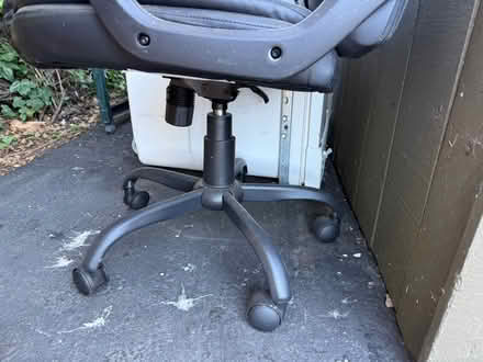 Photo of free Black vinyl office chair w armrests (1075 Valencia Avenue) #3