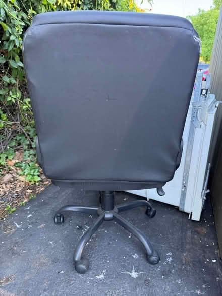 Photo of free Black vinyl office chair w armrests (1075 Valencia Avenue) #4