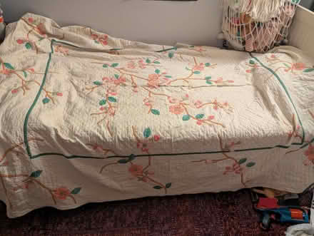 Photo of free Lovely cherry blossom quilt w/tear (Wash Hts/Inwood) #1