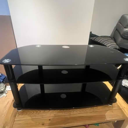 Photo of free Black Glass TV stand (Church RG2) #1