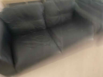 Photo of free 2 black leather sofas (Golborne) #1