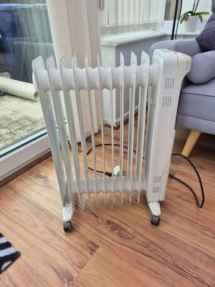 Photo of free Massage bed and oil filled radiator (Moss Side PR26) #1