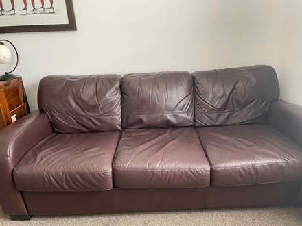 Photo of free Brown leather DFS sofa and footstool (Clare Street area NN1) #2