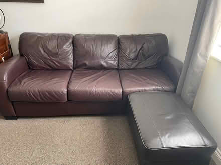 Photo of free Brown leather DFS sofa and footstool (Clare Street area NN1) #1