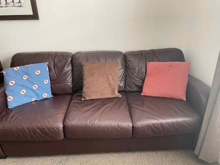 Photo of free Brown leather DFS sofa and footstool (Clare Street area NN1) #3