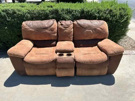 Photo of free Leather reclining love seat (North Grand Junction) #1