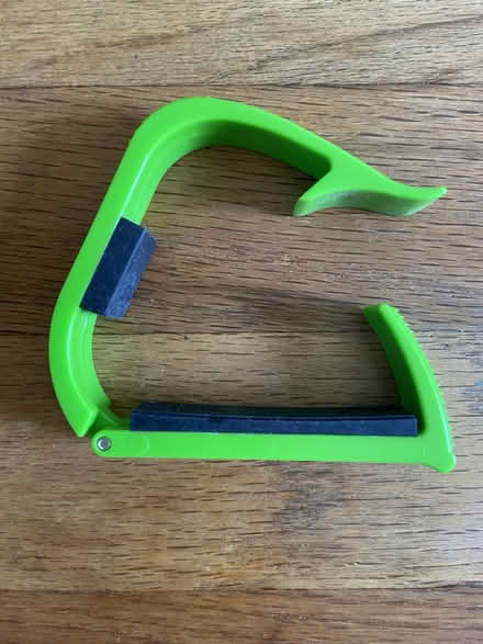 Photo of free Green plastic capo (Ann Arbor Northwest Side) #1