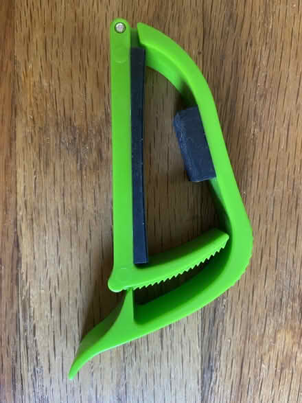 Photo of free Green plastic capo (Ann Arbor Northwest Side) #4