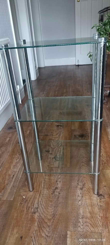 Photo of free Small glass shelving unit (Burnage (M19).) #1