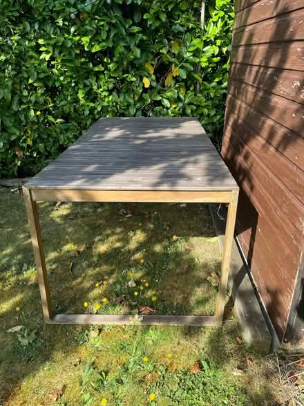 Photo of free Acacia wood garden table (“Lennox” table by Laura James) (Dane Mead RG24) #3