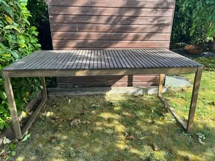 Photo of free Acacia wood garden table (“Lennox” table by Laura James) (Dane Mead RG24) #1