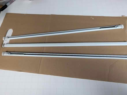 Photo of free Three 24 to 36 inch curtain rods (Burlingame Easton Addition) #1