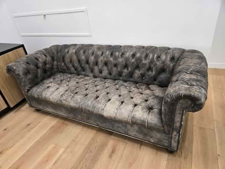 Photo of free Faux distressed leather couch (Financial District.) #1