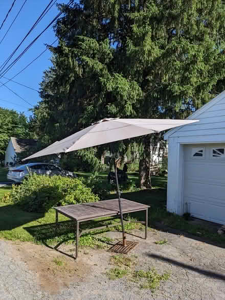 Photo of free Outdoor table and umbrella (North Frederick) #1