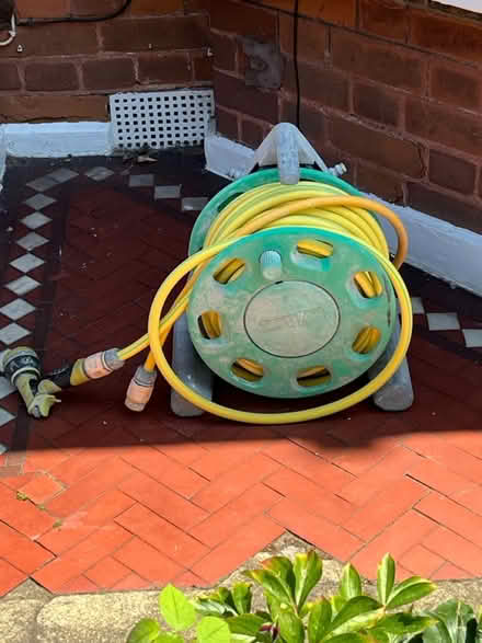 Photo of free Garden Hose + Reel and attachments (East Sheen. SW14) #1