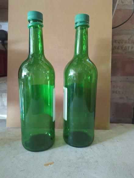 Photo of free Six green bottles with plastic screw tops (Woodhouse Eaves LE12) #1