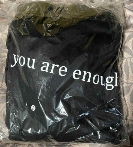 Photo of free Black hoodie w/ message (12th & Otis Streets NE) #1