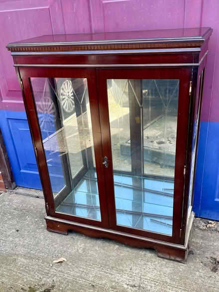 Photo of free Red wood glass cabinet with two glass shelves and key to loc (Woodhouse S13) #1