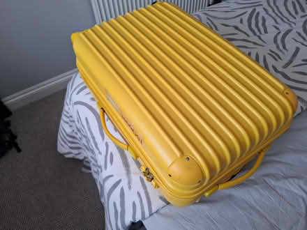 Photo of free Medium yellow suit case 4 wheels (CT14) #1