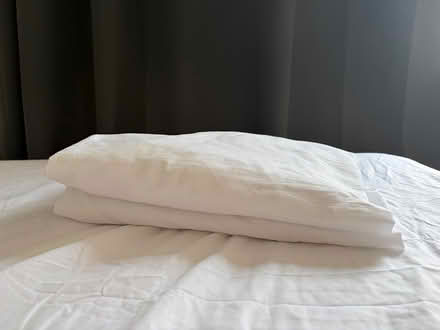 Photo of free 2 white double cotton bedsheets (Earl’s Court SW5) #1