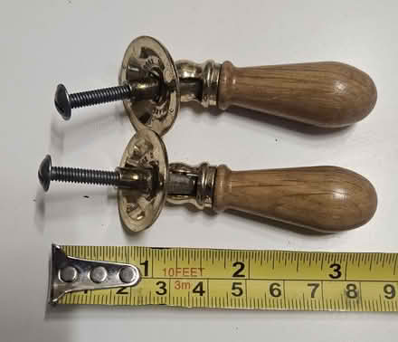 Photo of free 2 wood/metal door/drawer handles (Southwater RH13) #1