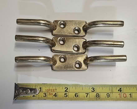 Photo of free 3 Large brass cord ties (Southwater RH13) #1