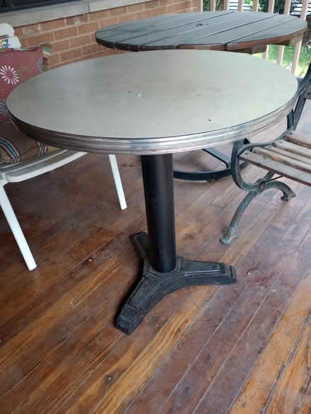 Photo of free VERY heavy cast iron cafe table (55th & Main) #1