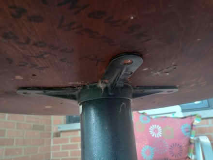 Photo of free VERY heavy cast iron cafe table (55th & Main) #2