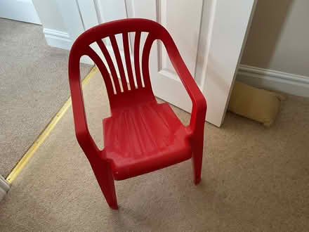 Photo of free Childβs red plastic chair (Cross hills Keighley Bd20) #1
