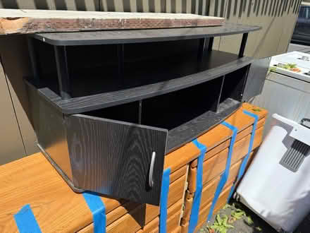 Photo of free Wooden TV stand w shelves (1075 Valencia Avenue) #1