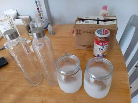 Photo of free 2 glass water bottles 2 candle jars (Downhead Park MK15) #1