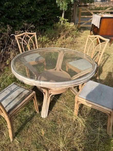 Photo of free Rattan Table with Glass Top and Four Chairs (Eckington WR10) #1
