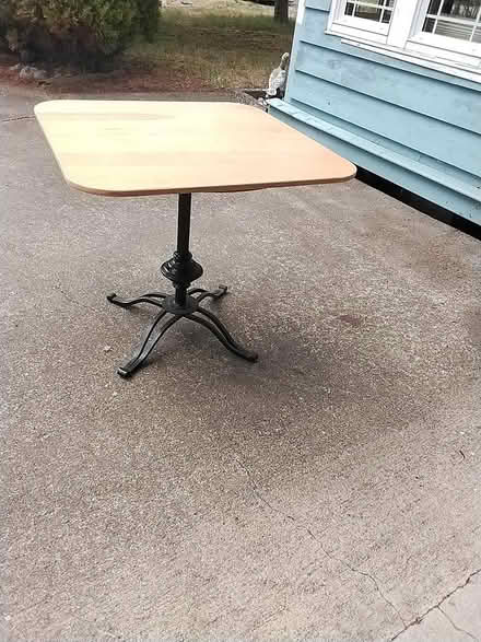Photo of free Small wooden table with metal base (Little River) #1