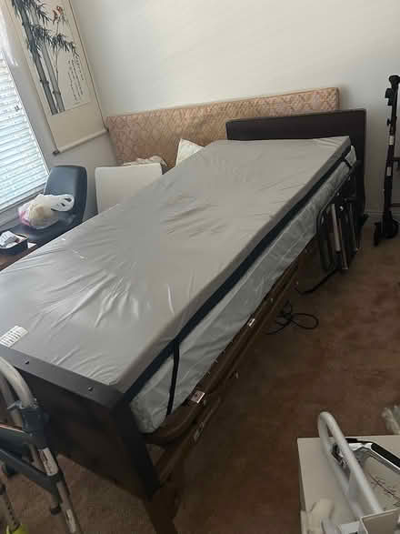 Photo of free Hospital bed and shower chair (Crofton) #1