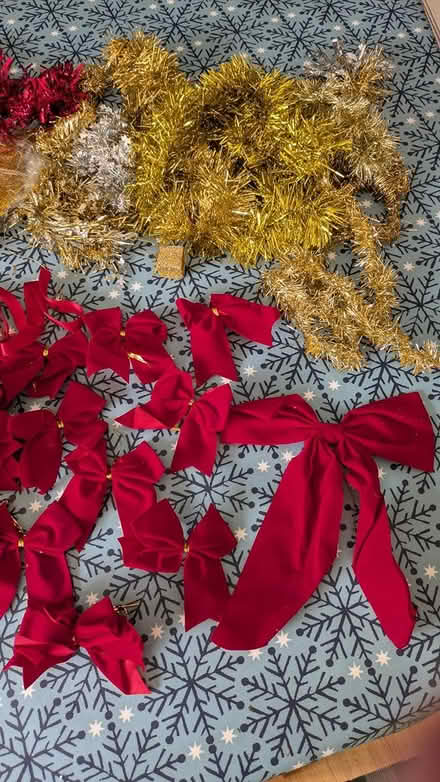 Photo of free Red bows and scraps of tinsel (Welwyn Garden City AL8) #1