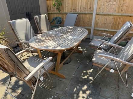 Photo of free patio table, 8 chairs cushions (Fair oak SO50 8DD) #1