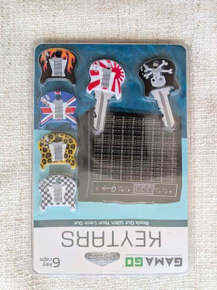 Photo of free 6 Key Caps / Covers - Guitar-shaped (Buckhurst Hill IG9) #1