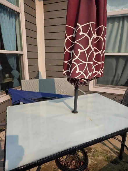 Photo of free Glass top patio table with umbrella (Grove City) #1