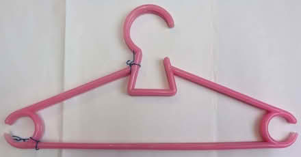 Photo of free Two pink, clothes hangers (Levenshulme M12) #1