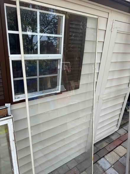 Photo of free Storm door glass insert (Latham) #2