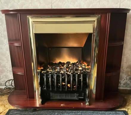 Photo of free Freestanding Electric Fireplace in oak & brass. (New Milton BH25) #1