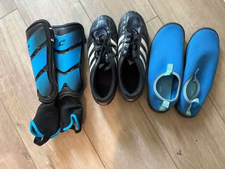 Photo of free Boys size 5 cleats & water shoes (Polo grounds Rd) #1