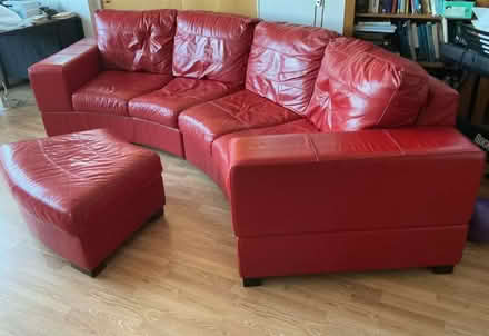 Photo of free Large red leather-effect sofa and pouffe (Western Harbour EH6) #1