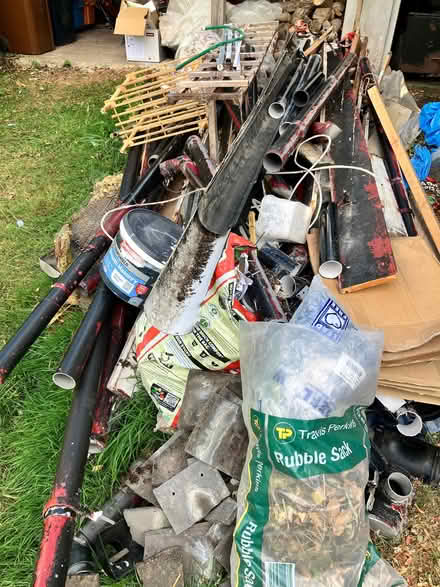 Photo of free Lengths of drainpipe and pieces of wood (Pant SY10) #1