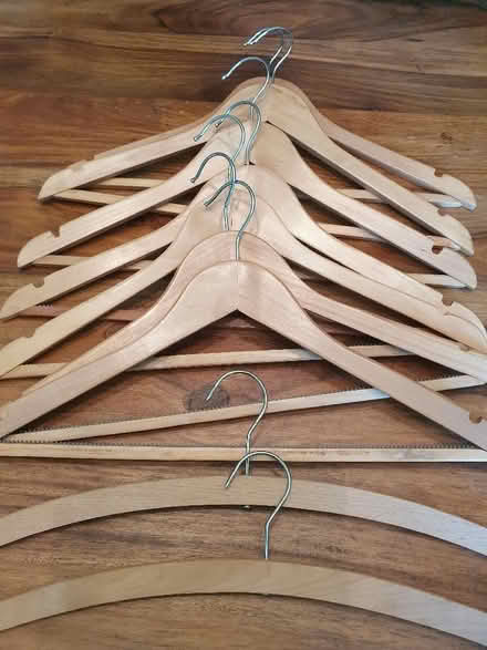 Photo of free 9 wooden coat hangers (Hungerford RG17) #1