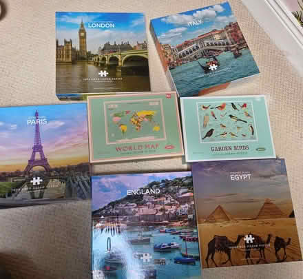 Photo of free 14 x 1,000 piece jigsaws (Strandtown BT4) #1