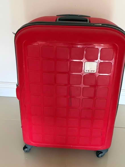 Photo of free Large watermelon (red) Tripp suitcase (Innsworth GL3) #1