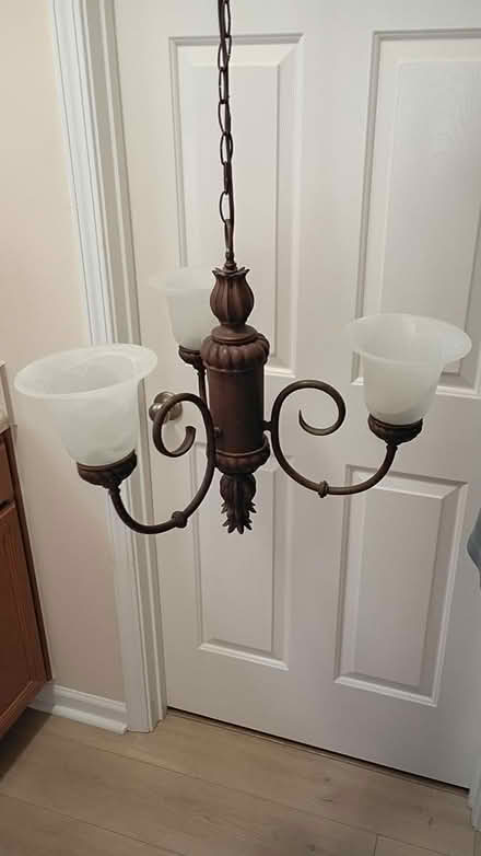 Photo of free Bronze 3 light chandelier (Villages of Rolesville) #1