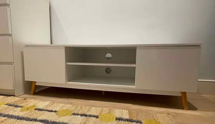Photo of free White TV stand with wooden legs (Fulham Palace Rd SW6) #1